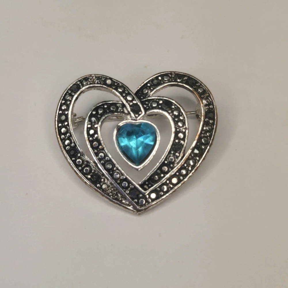 Rhinestone Marcasite Heart feature blue color stone.